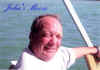 John on the boat - DVD pic.JPG (103338 bytes)
